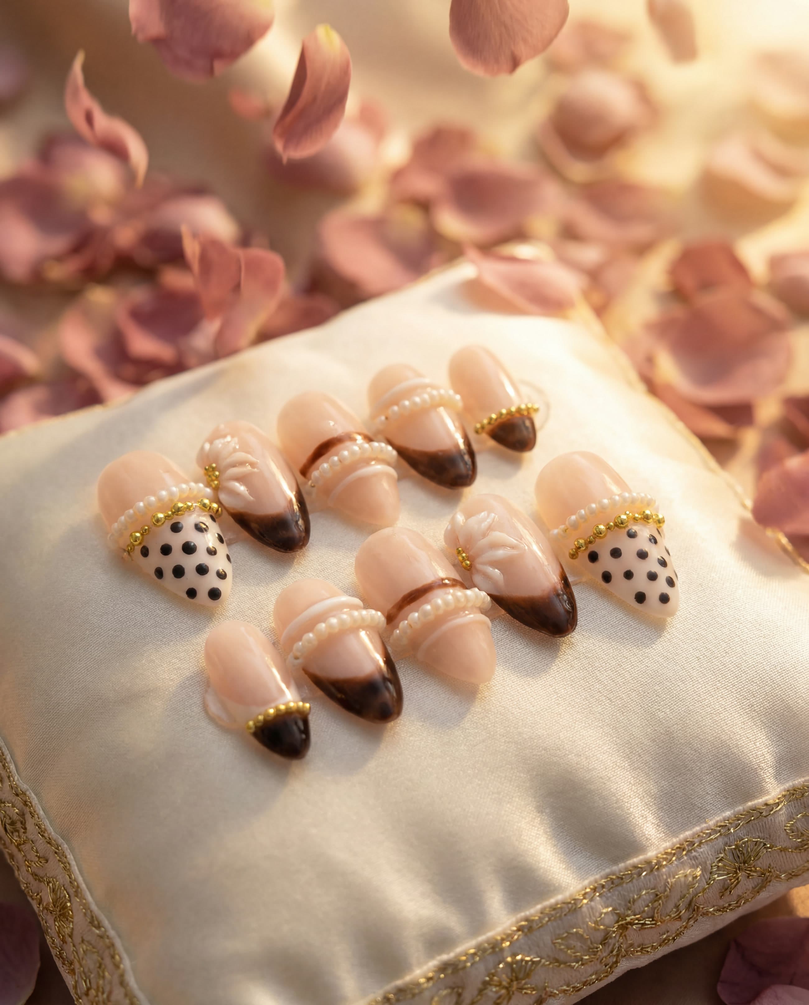 Caramel Chic — Blush French with ombre tips, gold bead chains and pearls, styled for bridal season
