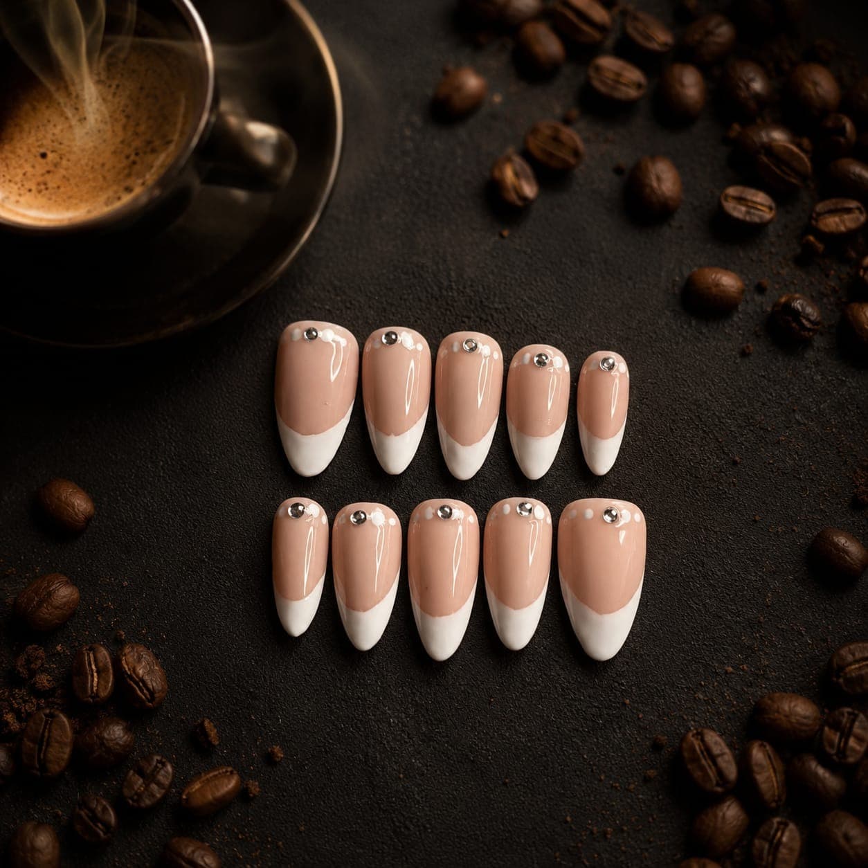 Diamond French — Nude-to-white reverse French tips with a single rhinestone and dot accents at the cuticle