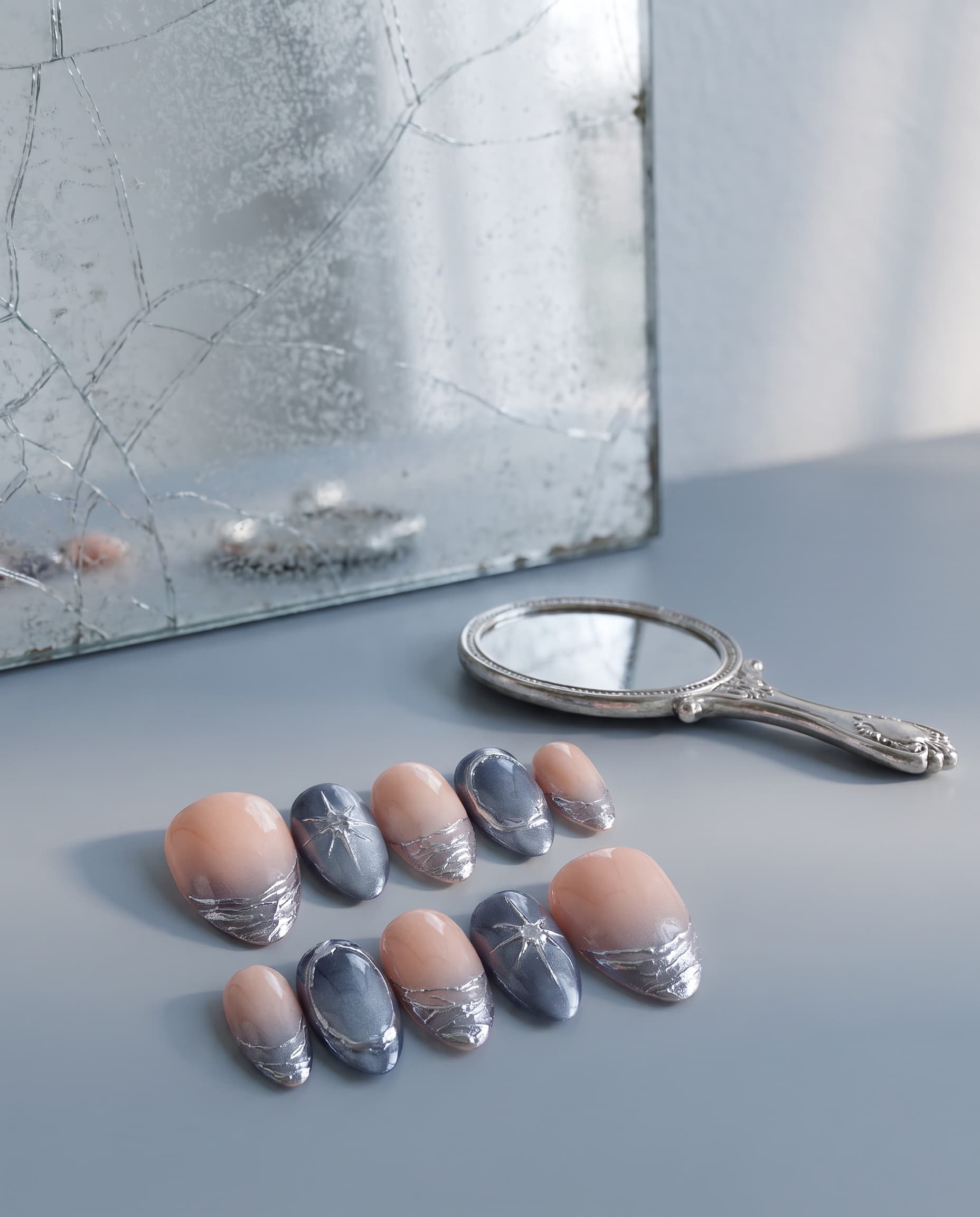Frost & Foil — Peach-to-grey ombre with a metallic crackle-foil texture and a silver star accent