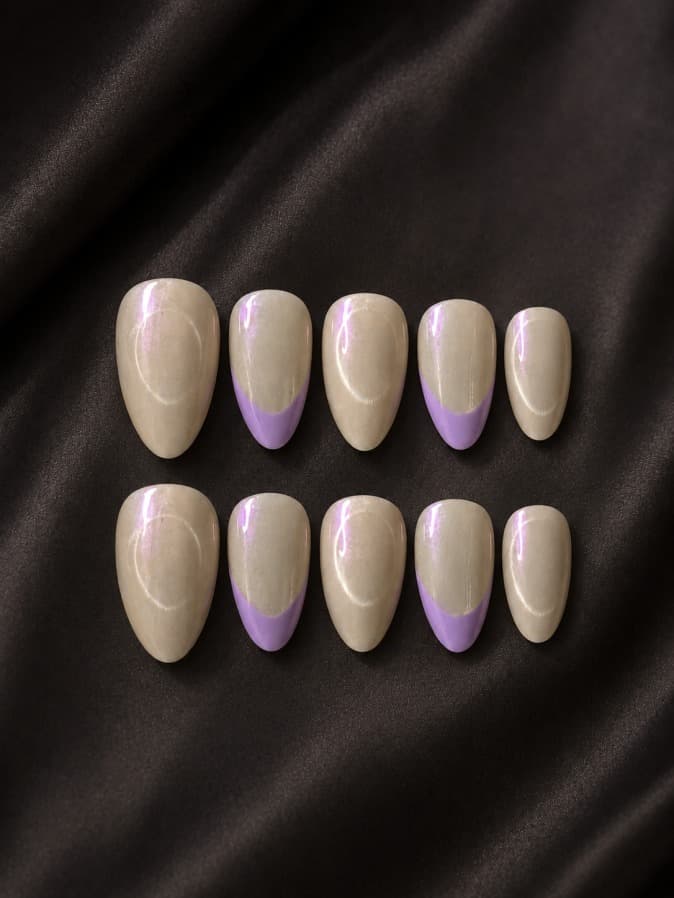 Lavender Silk (Cat Eye) — Champagne cat-eye base with soft lavender-purple French tips