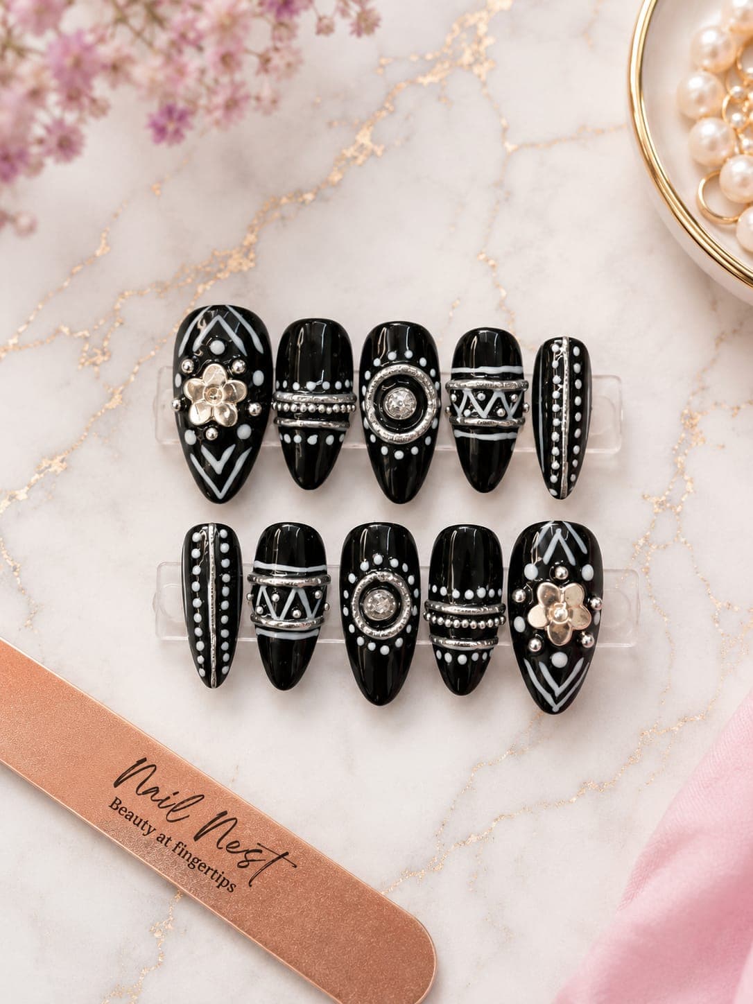 Aghori — Black and white with gold flower charms and silver ring bands